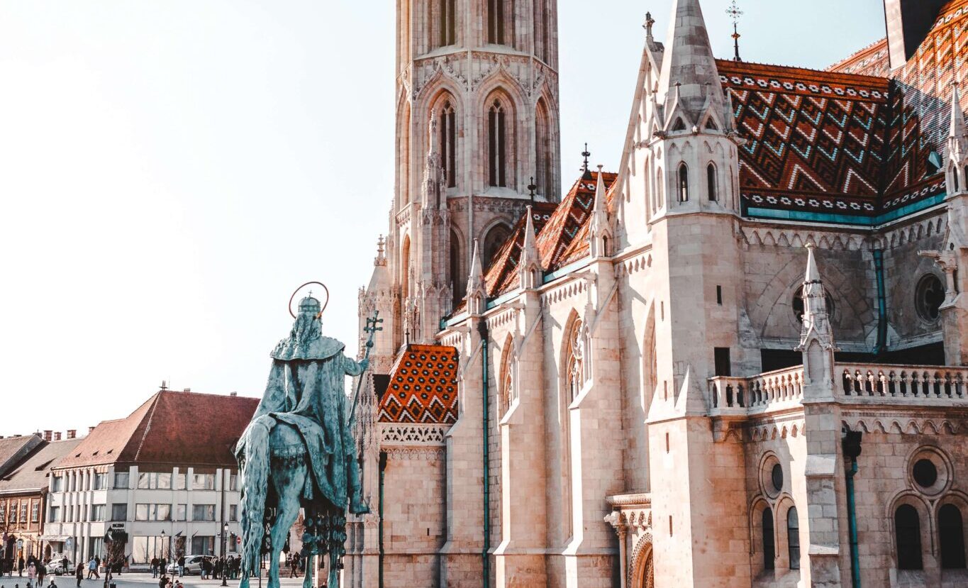 The old church and the bronze statue of Matthias Corvinus, King of Hungary, mounted on his horse.